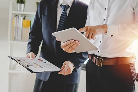 cropped-job-training-new-manager-boss-standing-teaching-online-work-with-mobile-tablet-young-intern-apprentice-learning-statistics-chart-working-office-1.jpg Cropped Job Training New Manager Boss Standing Teaching Online Work With Mobile Tablet Young Intern Apprentice Learning Statistics Chart Working Office 1